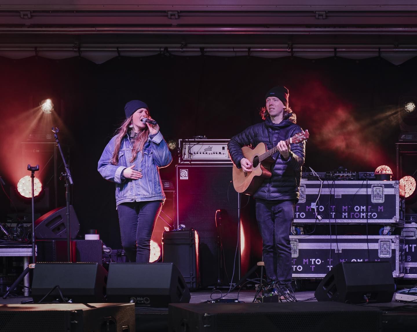 Elle and Alex performing on stage